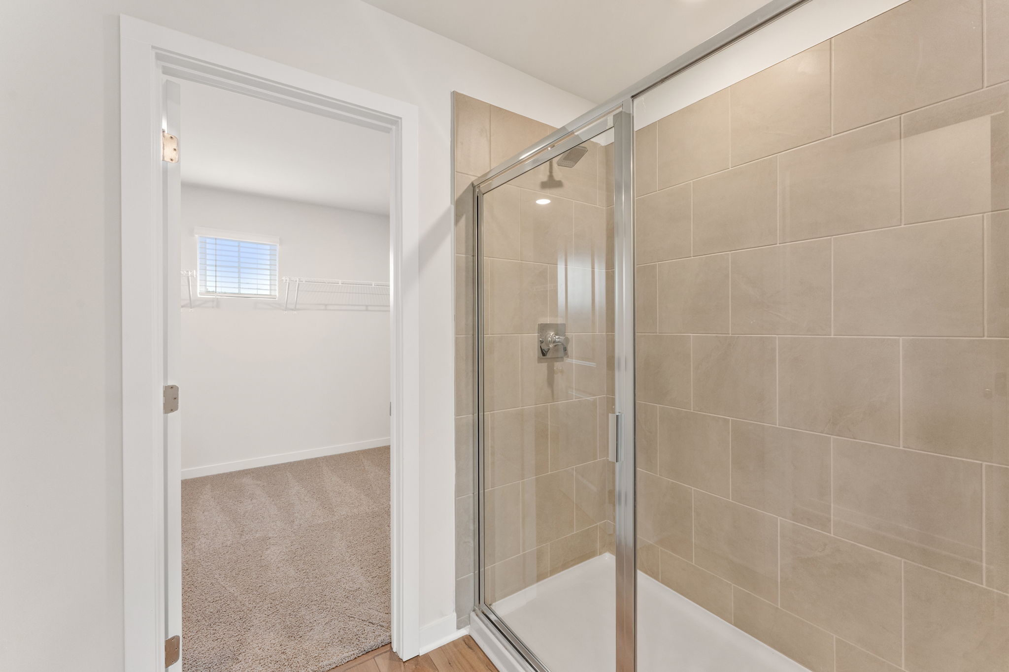 A shower with a glass door.