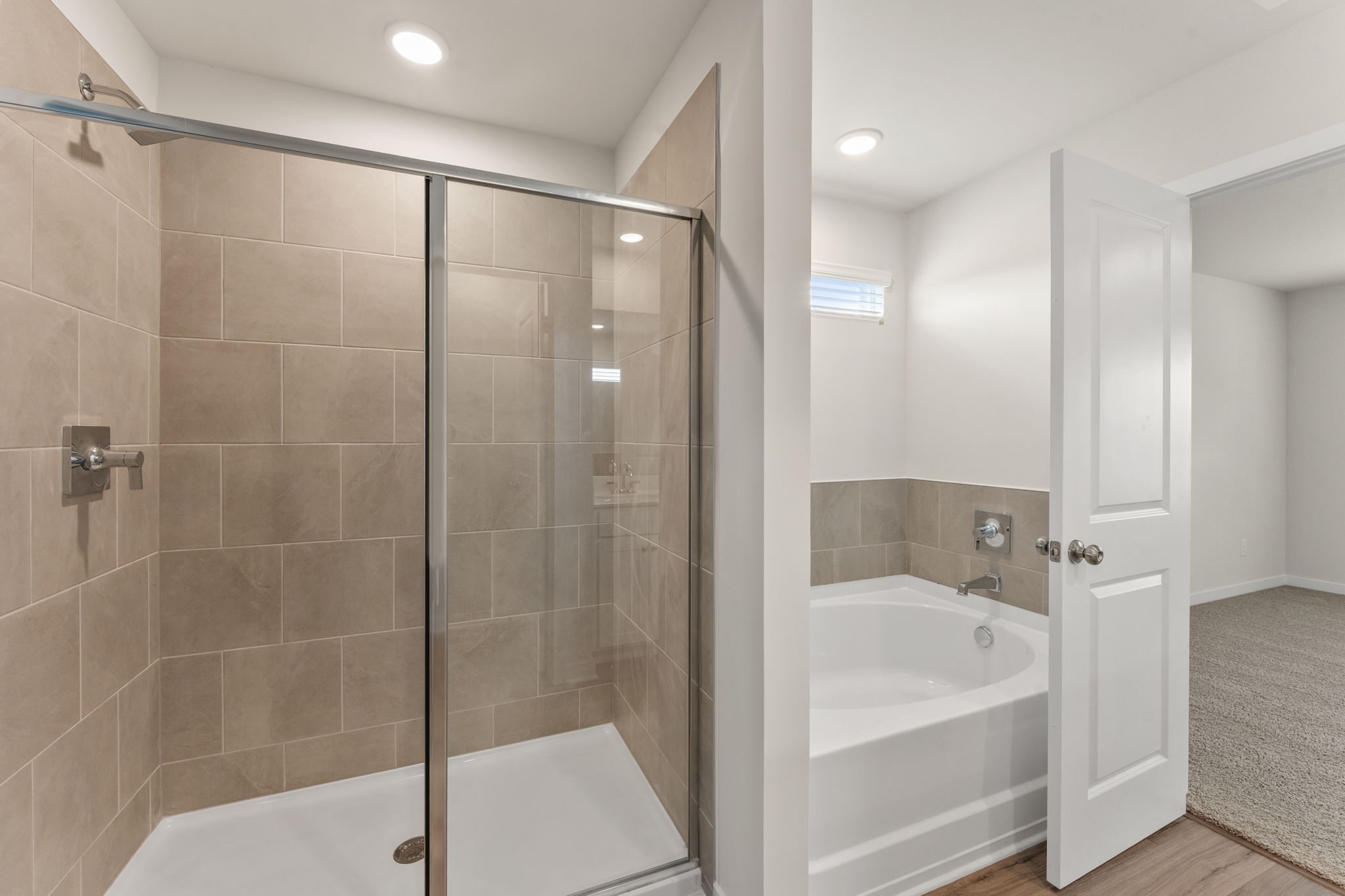 A bathroom with a glass shower.