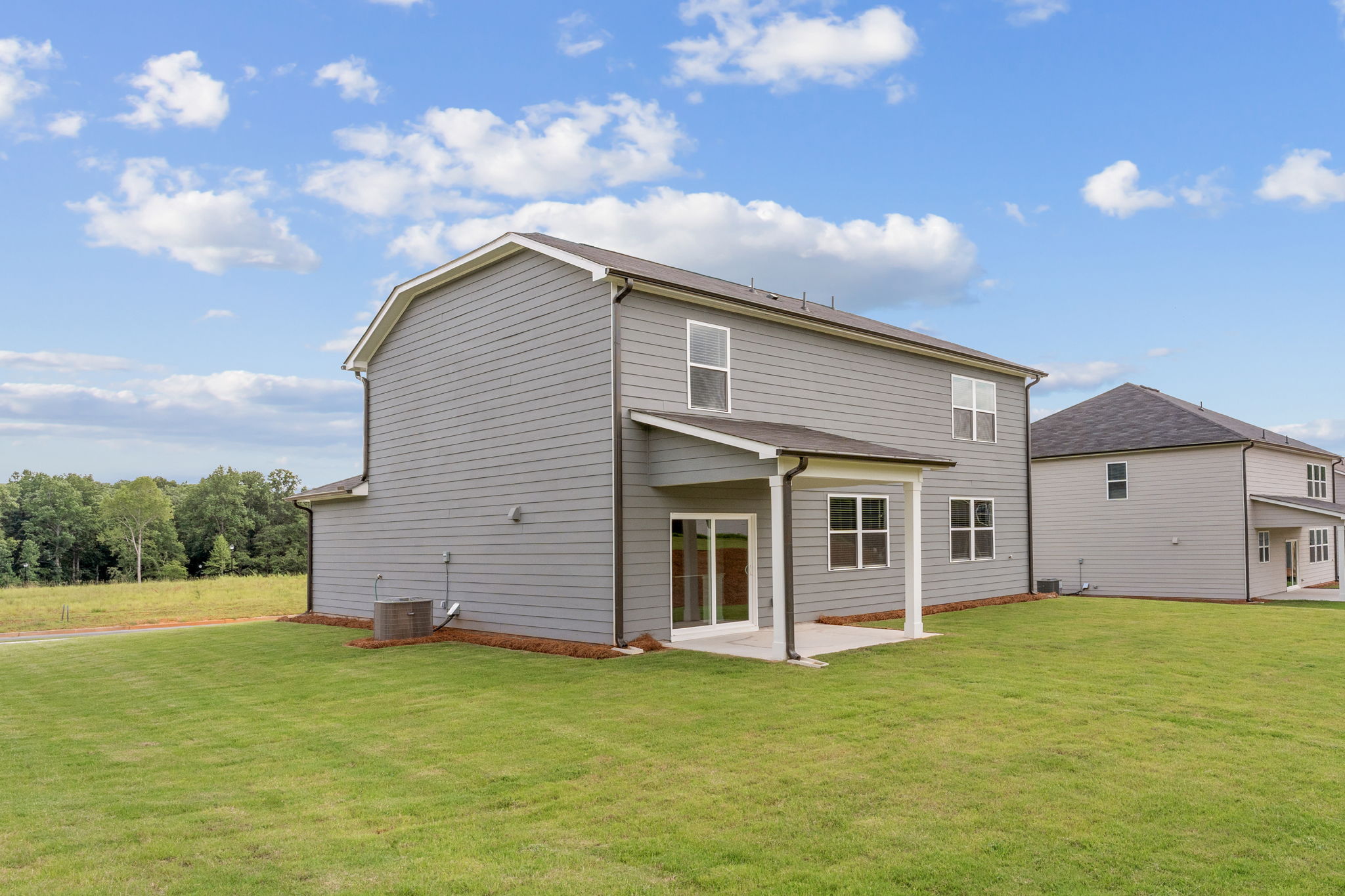 A house with a grass yard.