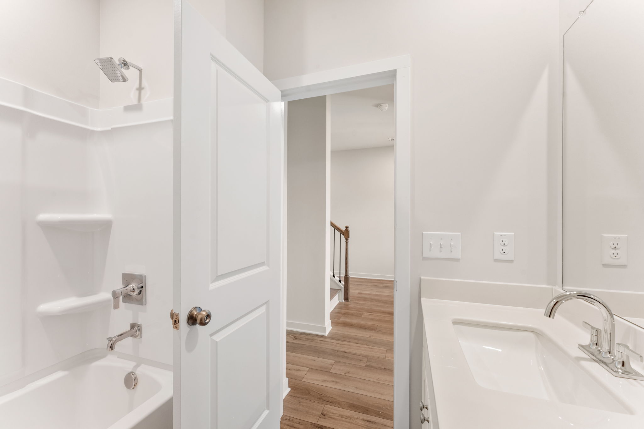 A bathroom with a sink and a bathtub.