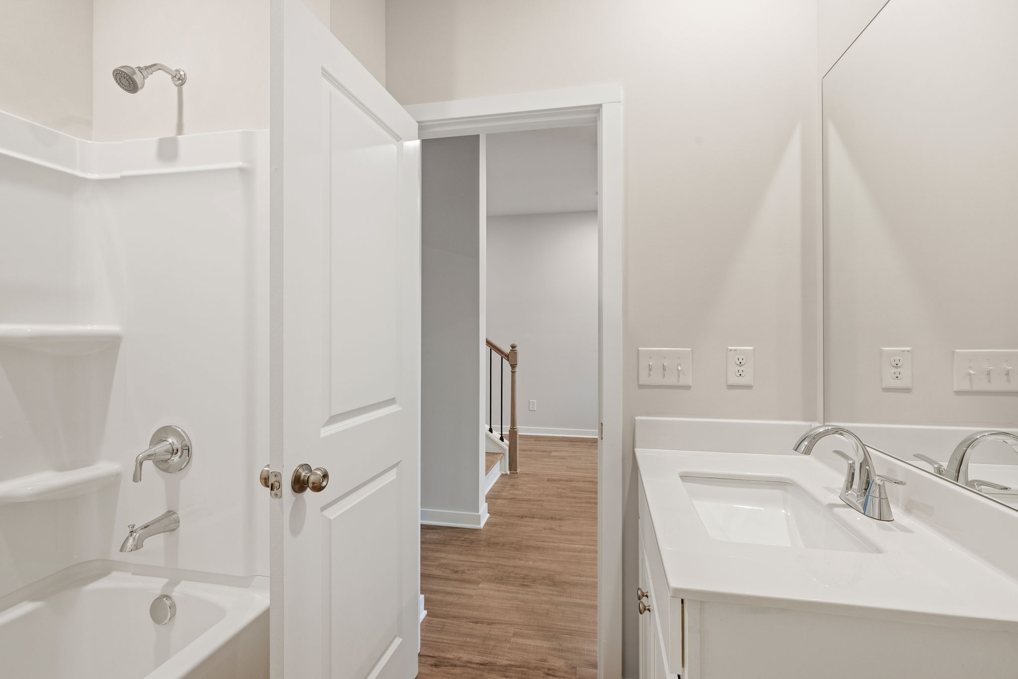 A bathroom with a sink and a bathtub.