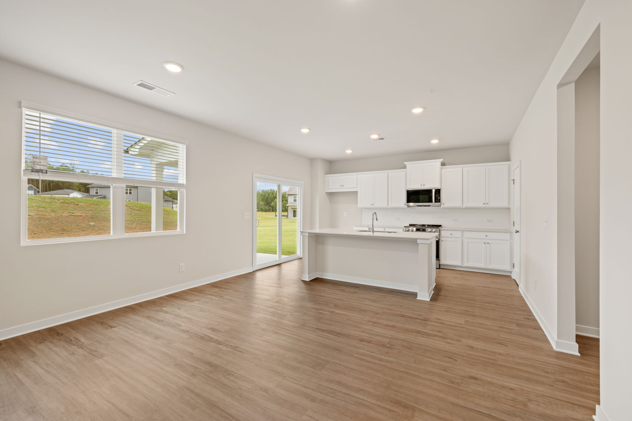 A large kitchen with white cabinets.