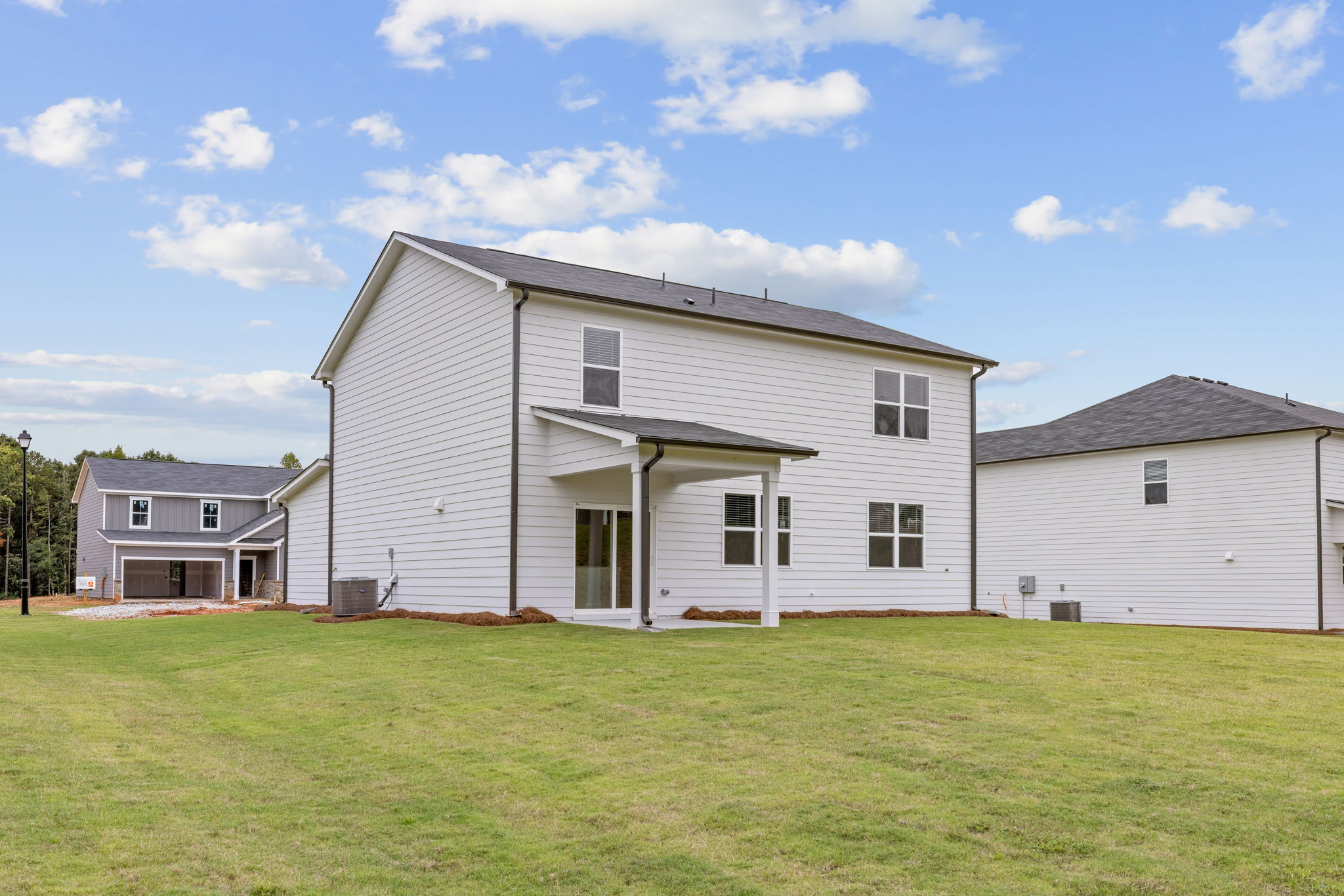 A house with a grass yard.