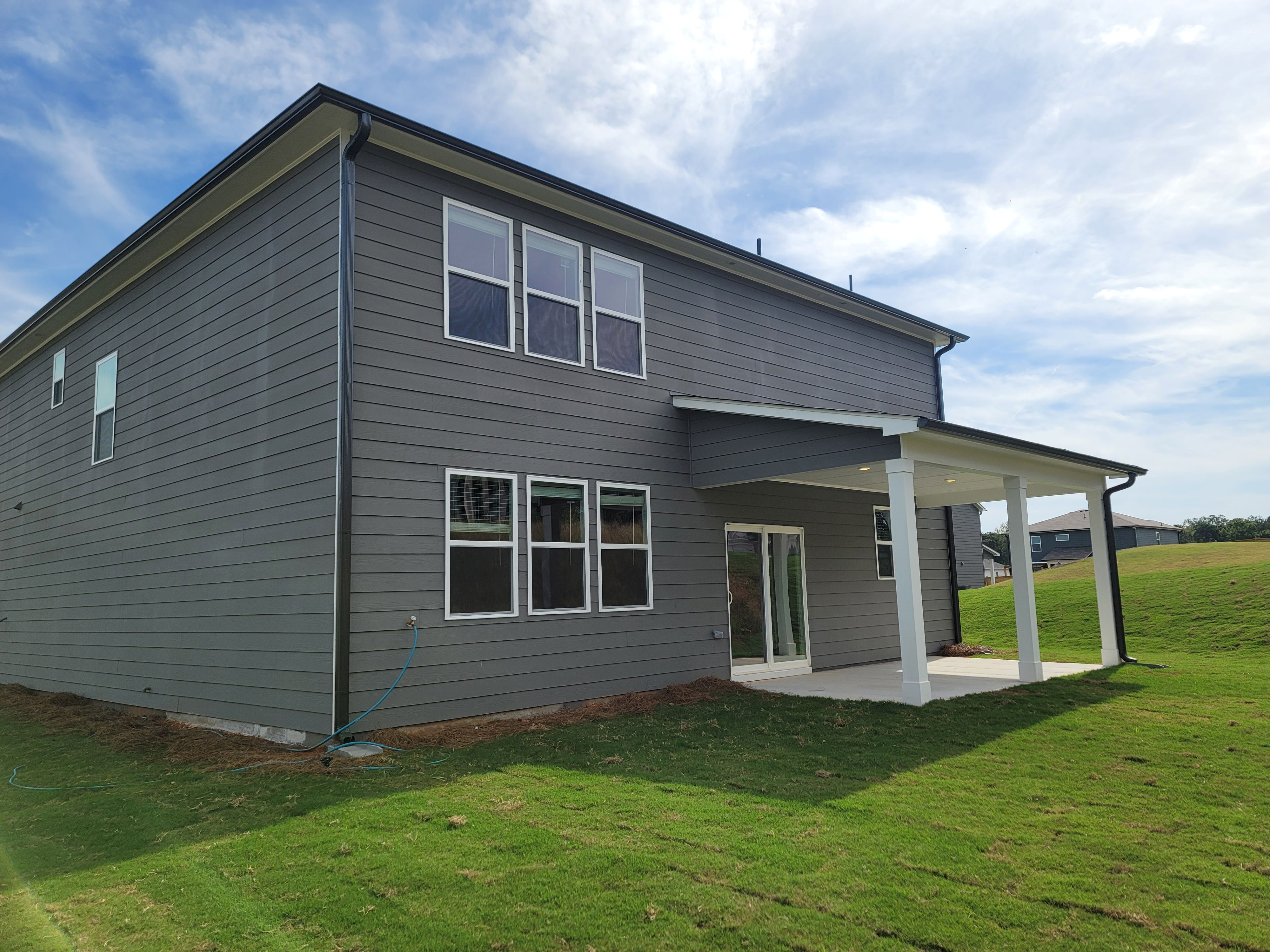A house with a grass yard.