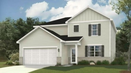 A white house with a garage.