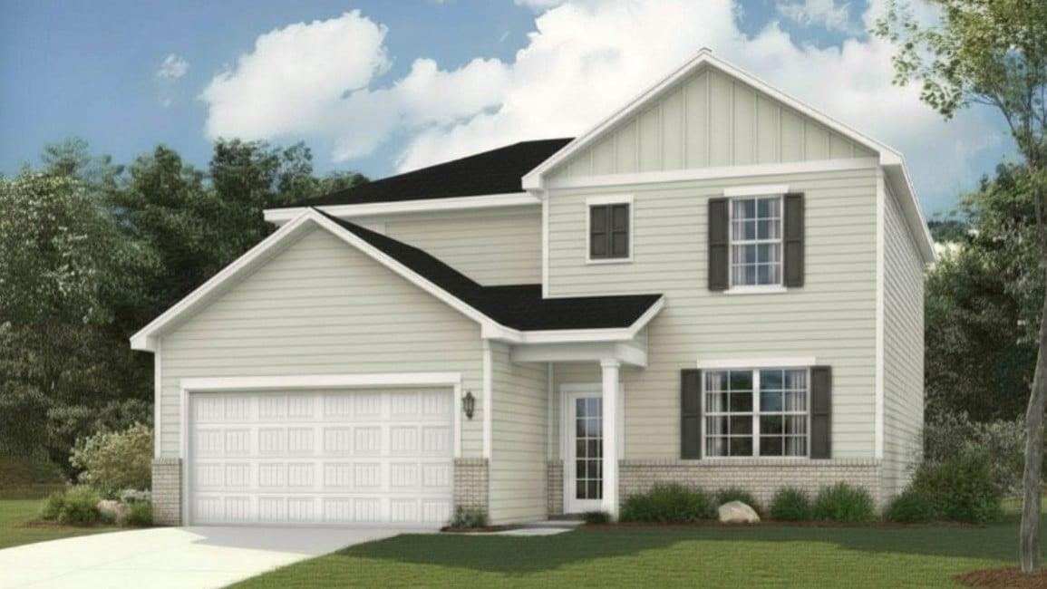 A white house with a garage.