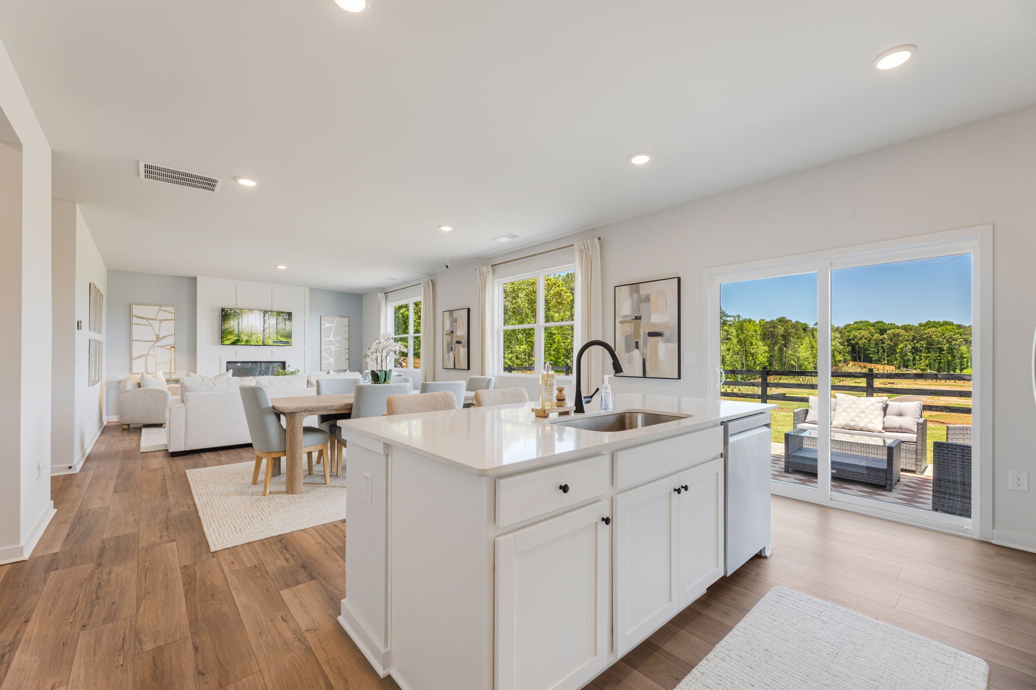 A kitchen with a large window.