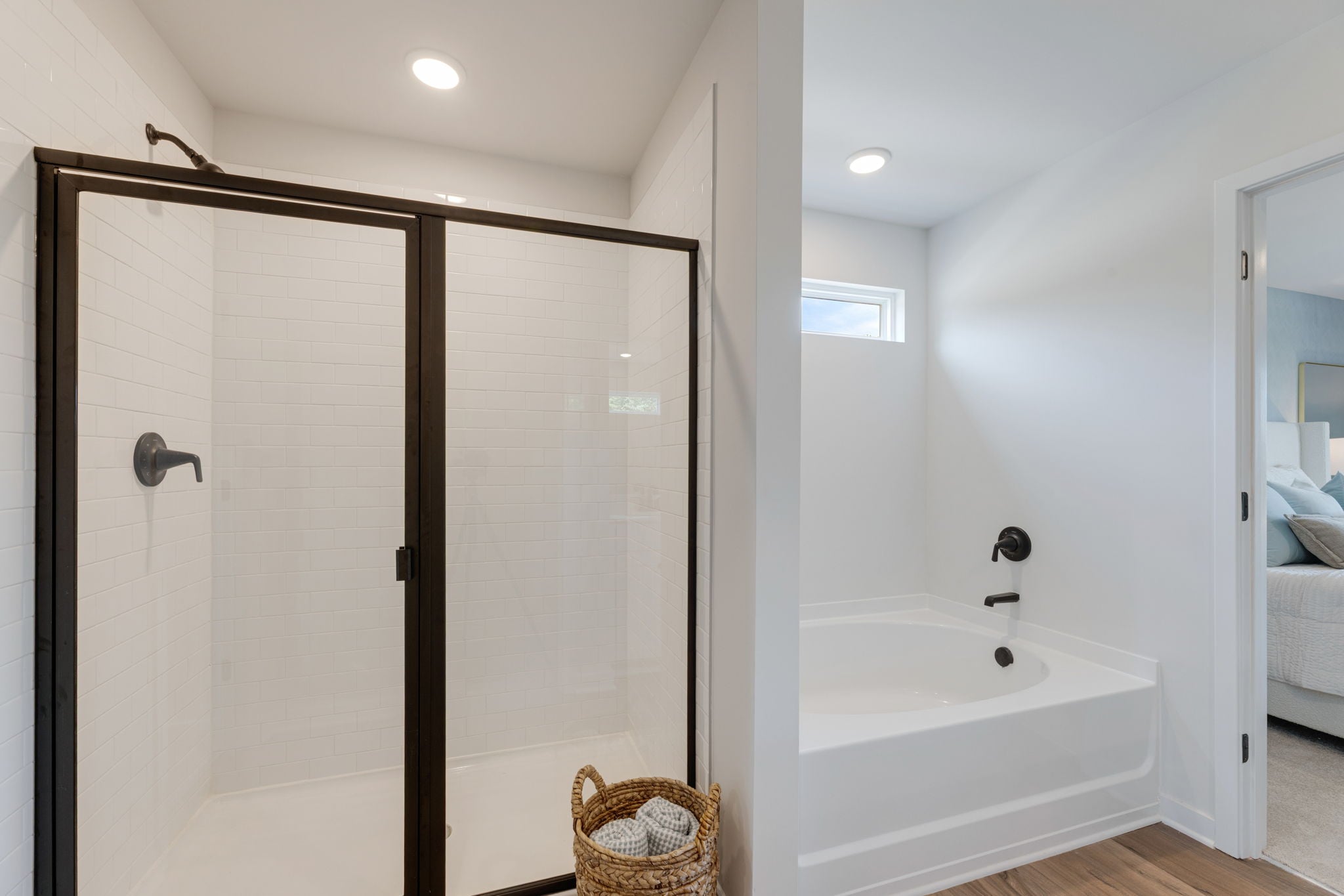 A bathroom with a tub and shower.