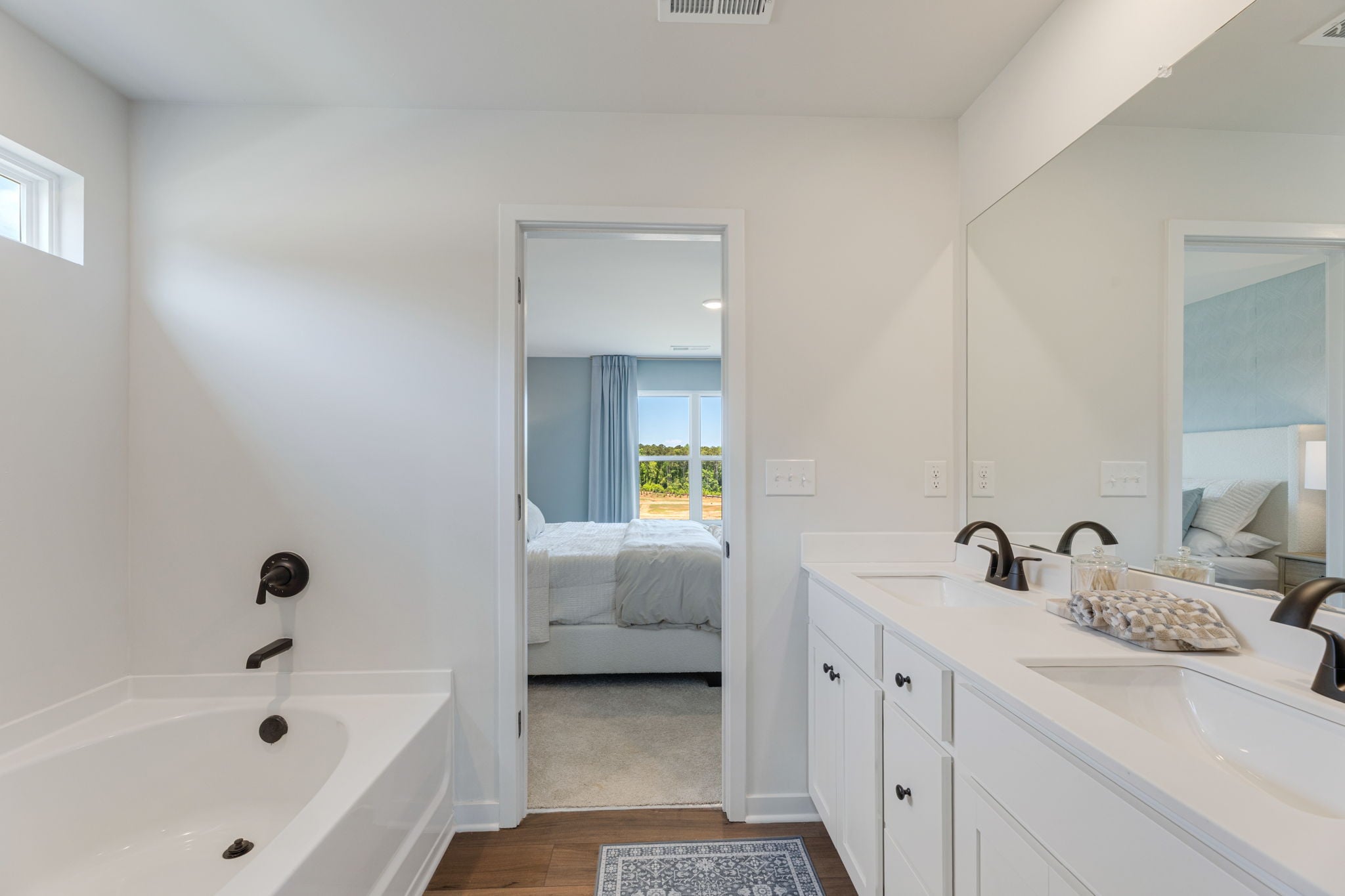 A bathroom with a tub sink and a bathtub.
