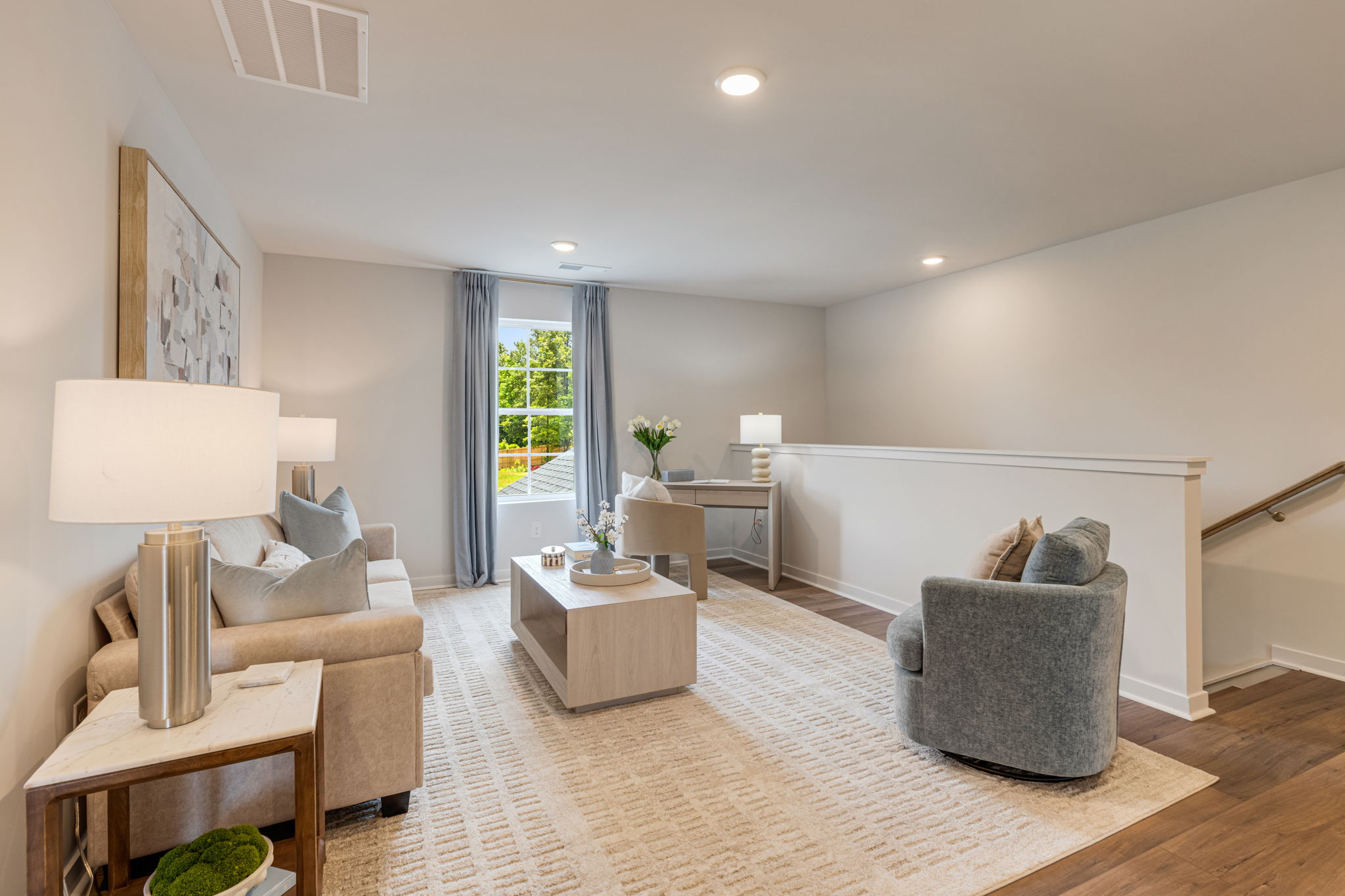 A living room with a couch and a table.