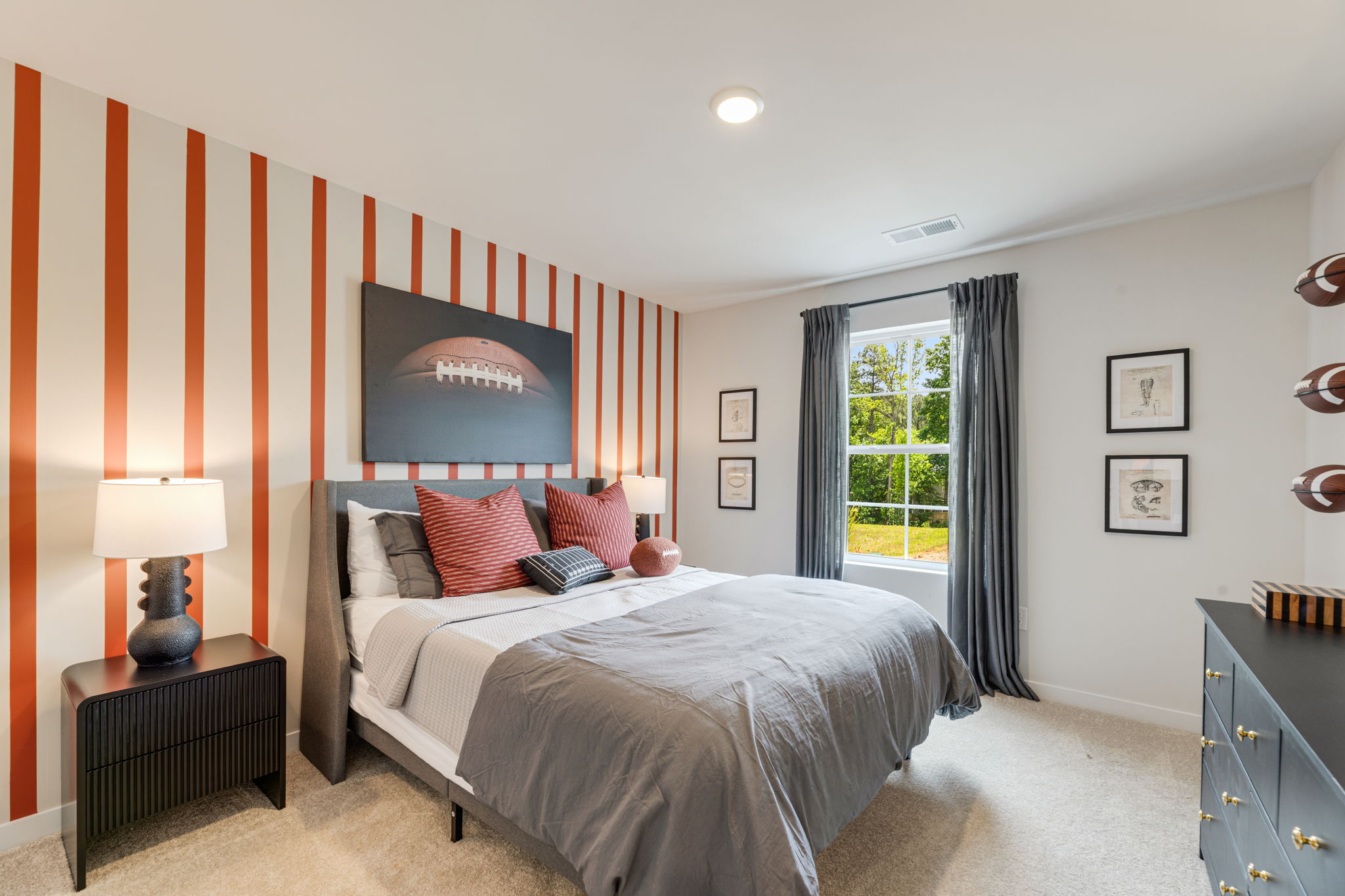 A bedroom with a bed and a window.