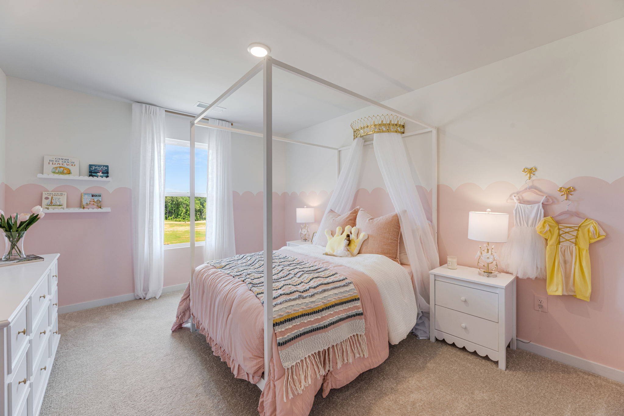 A bedroom with a bed and a window.