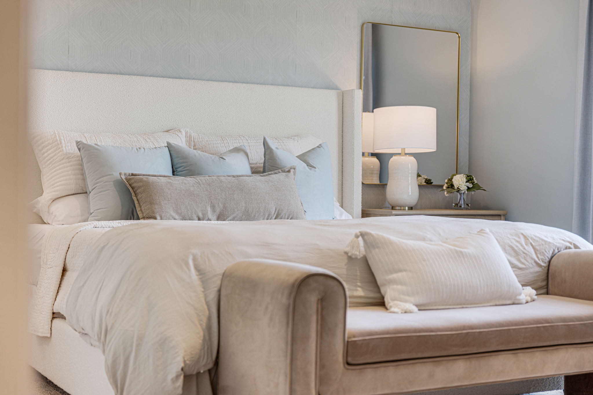 A bed with white pillows.