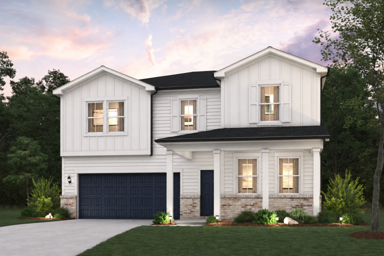 A white house with a garage.