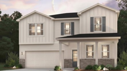 A white house with a driveway.