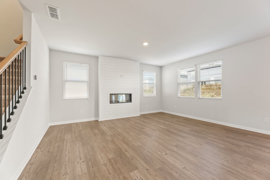 A room with a wood floor and a wood floor.