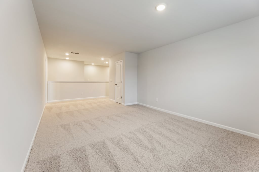 A hallway with white walls.