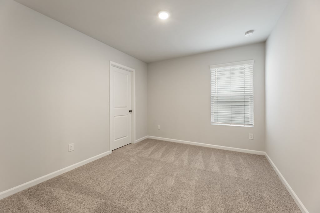 A room with a door and a window.