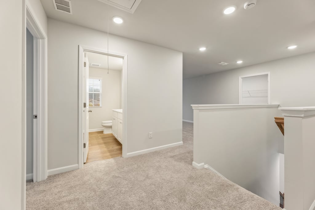 A bathroom with a shower unit.