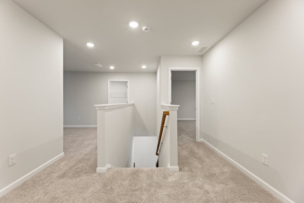 A room with a desk and a chair.