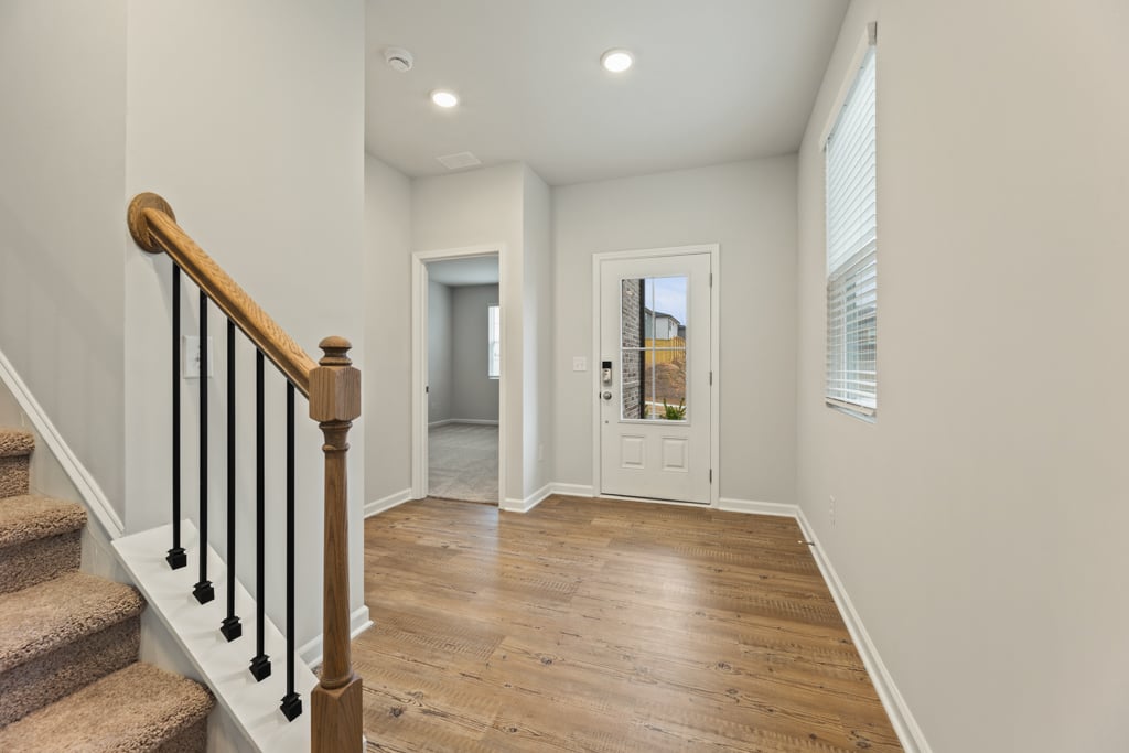 A hallway with wood floors.