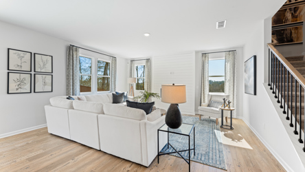 A living room with a white couch.