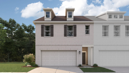 A white house with a driveway.