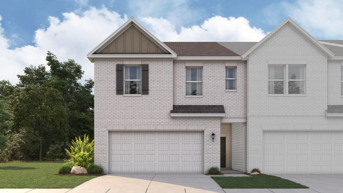A white house with a garage.