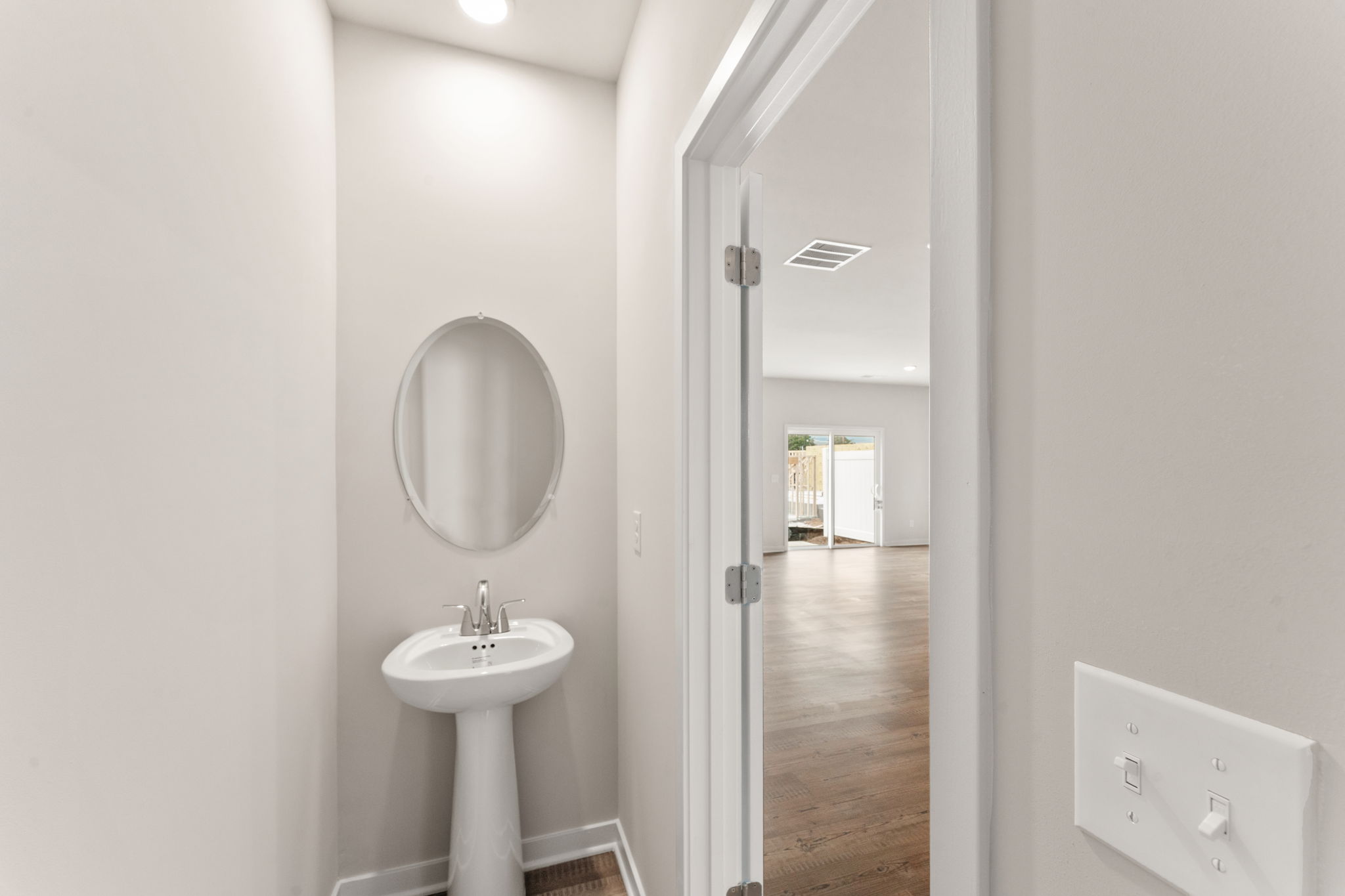 A bathroom with a sink and a mirror.
