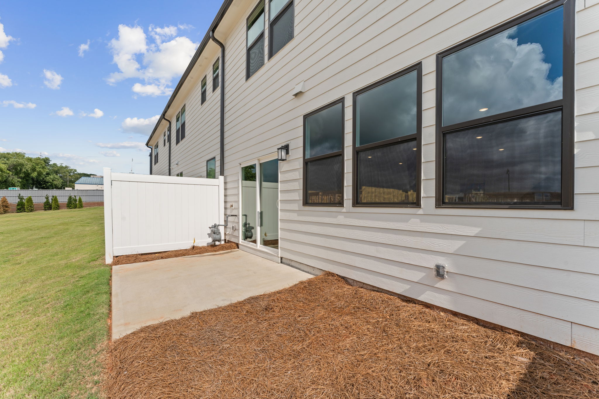 A building with a white fence.