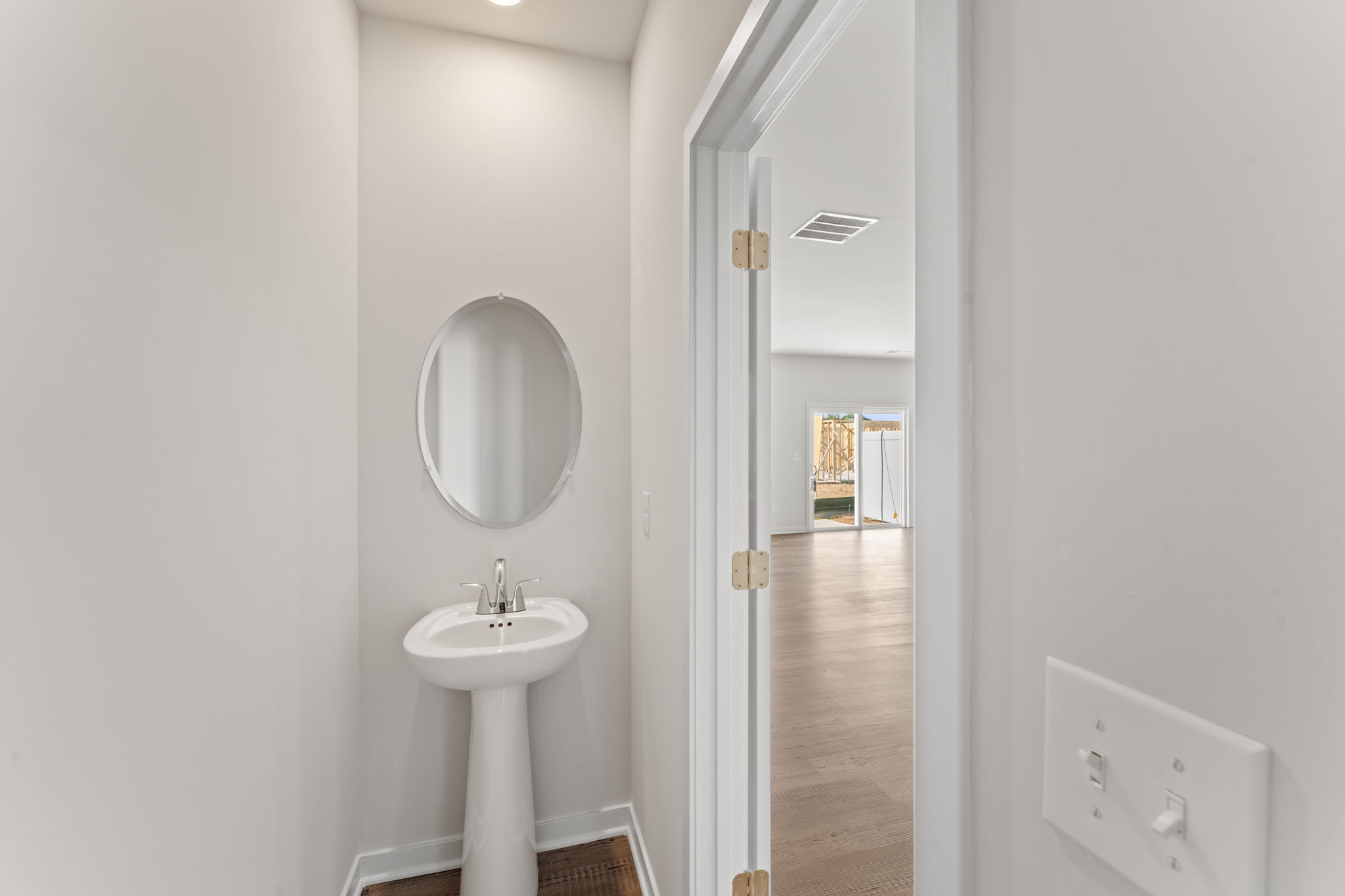 A bathroom with a sink and mirror.