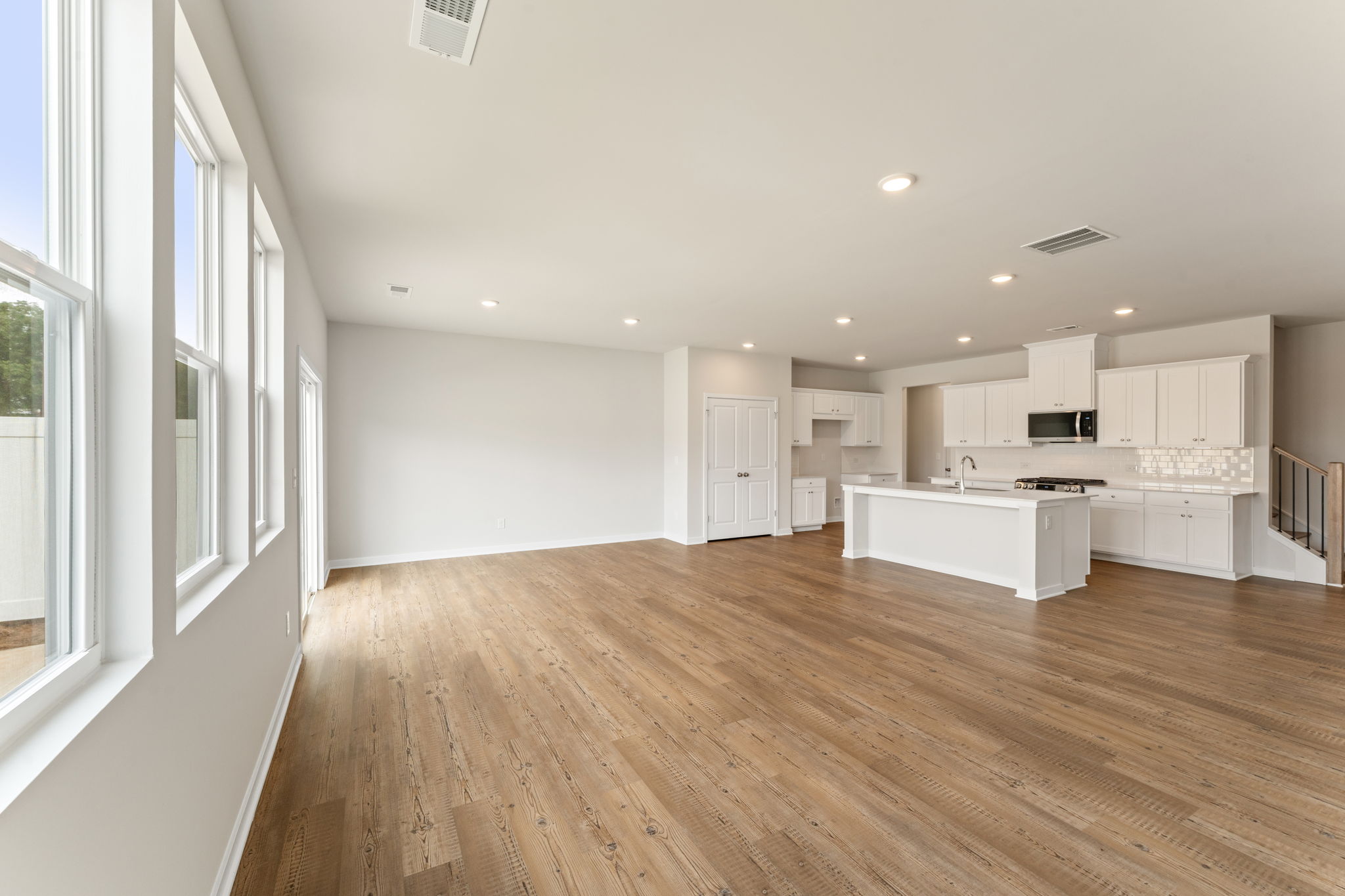 A large kitchen with white cabinets.