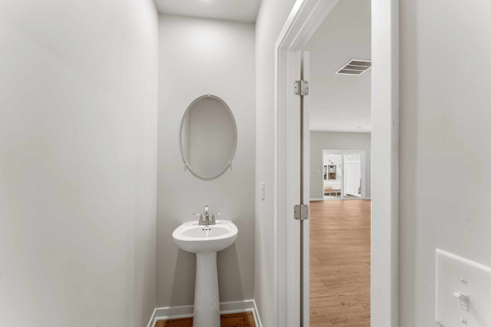 A bathroom with a mirror.