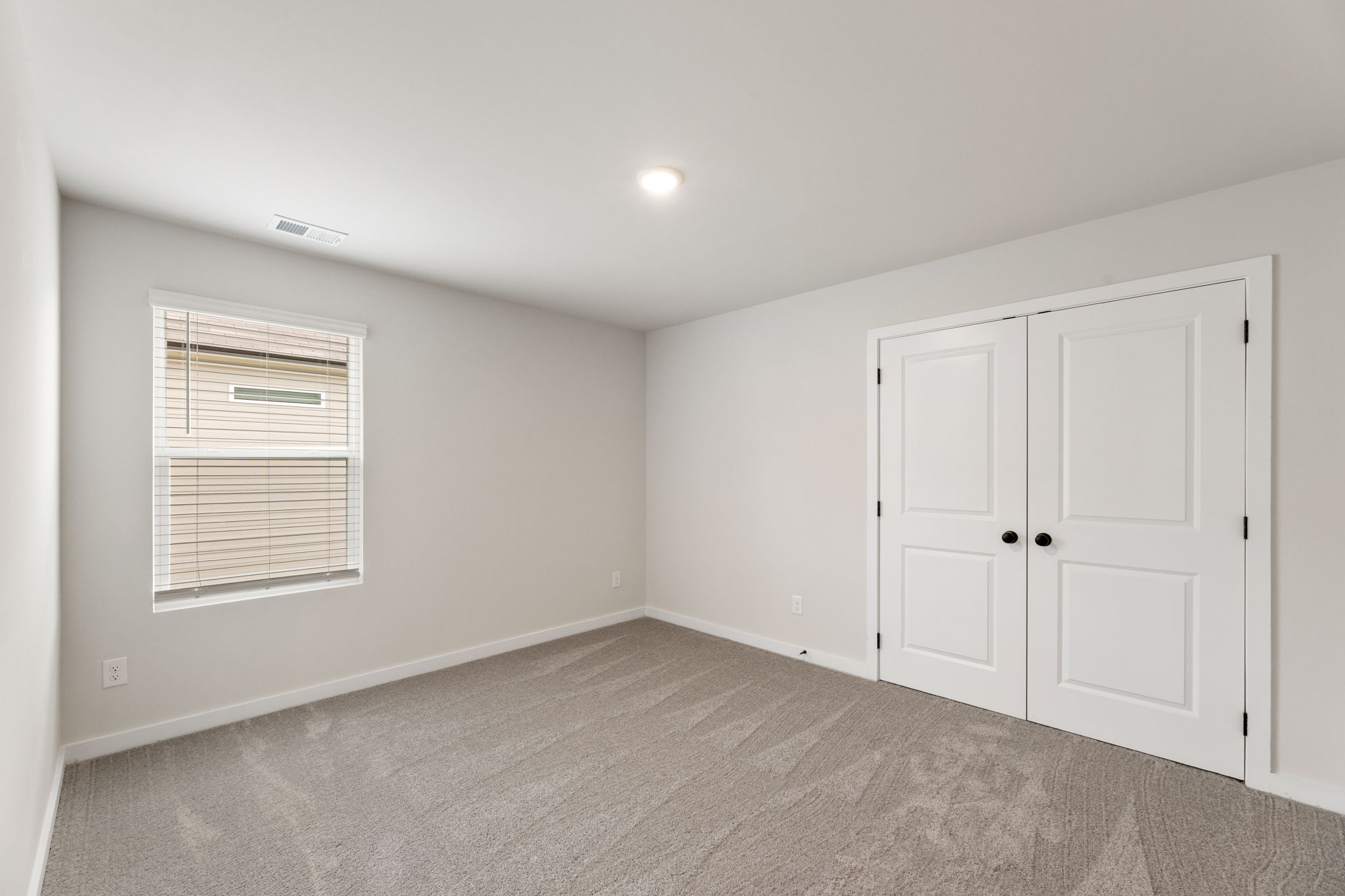 A room with white doors.