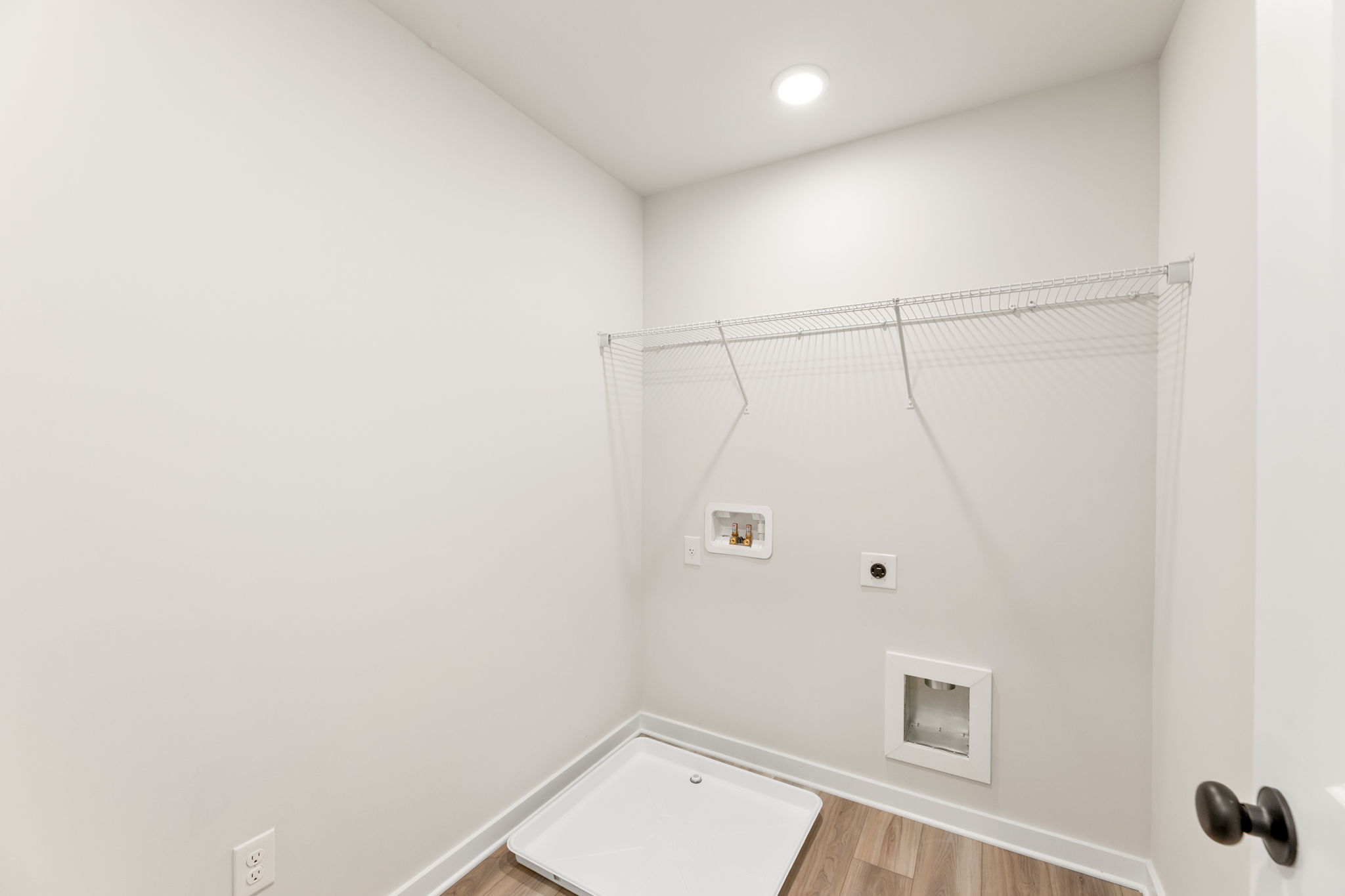 A shower with a glass door.