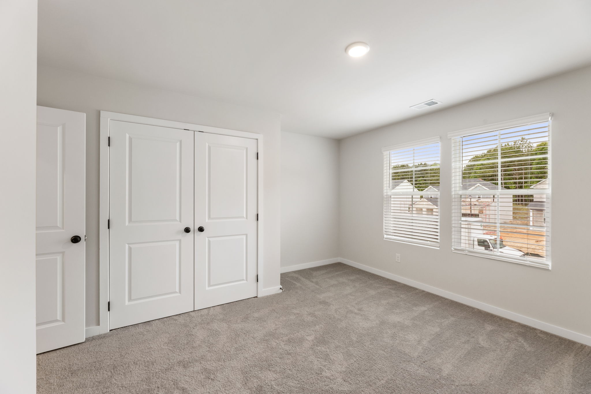 A room with white doors.