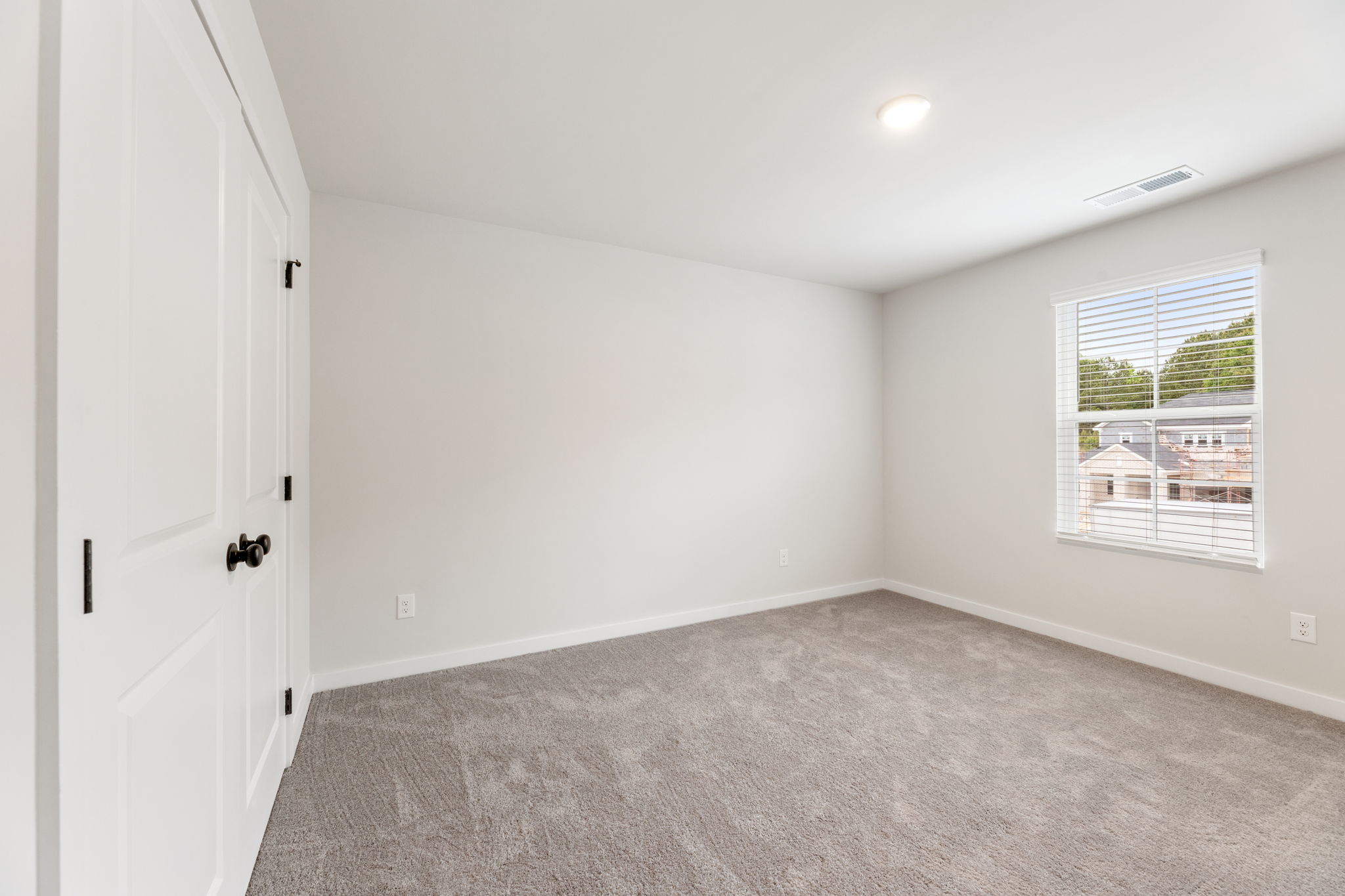 A room with a door and a window.
