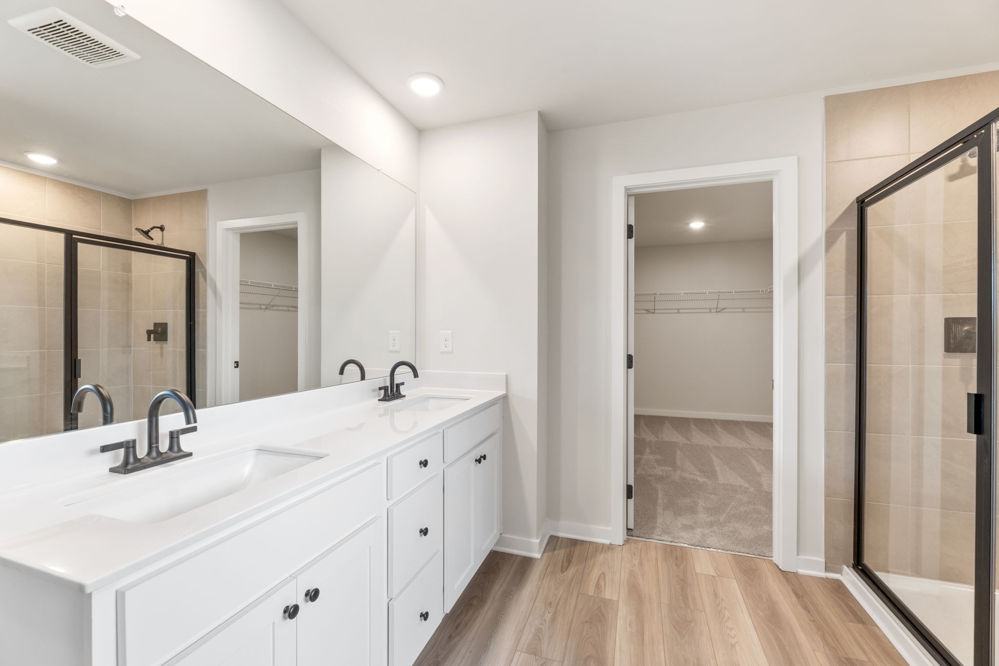 A bathroom with a glass shower.