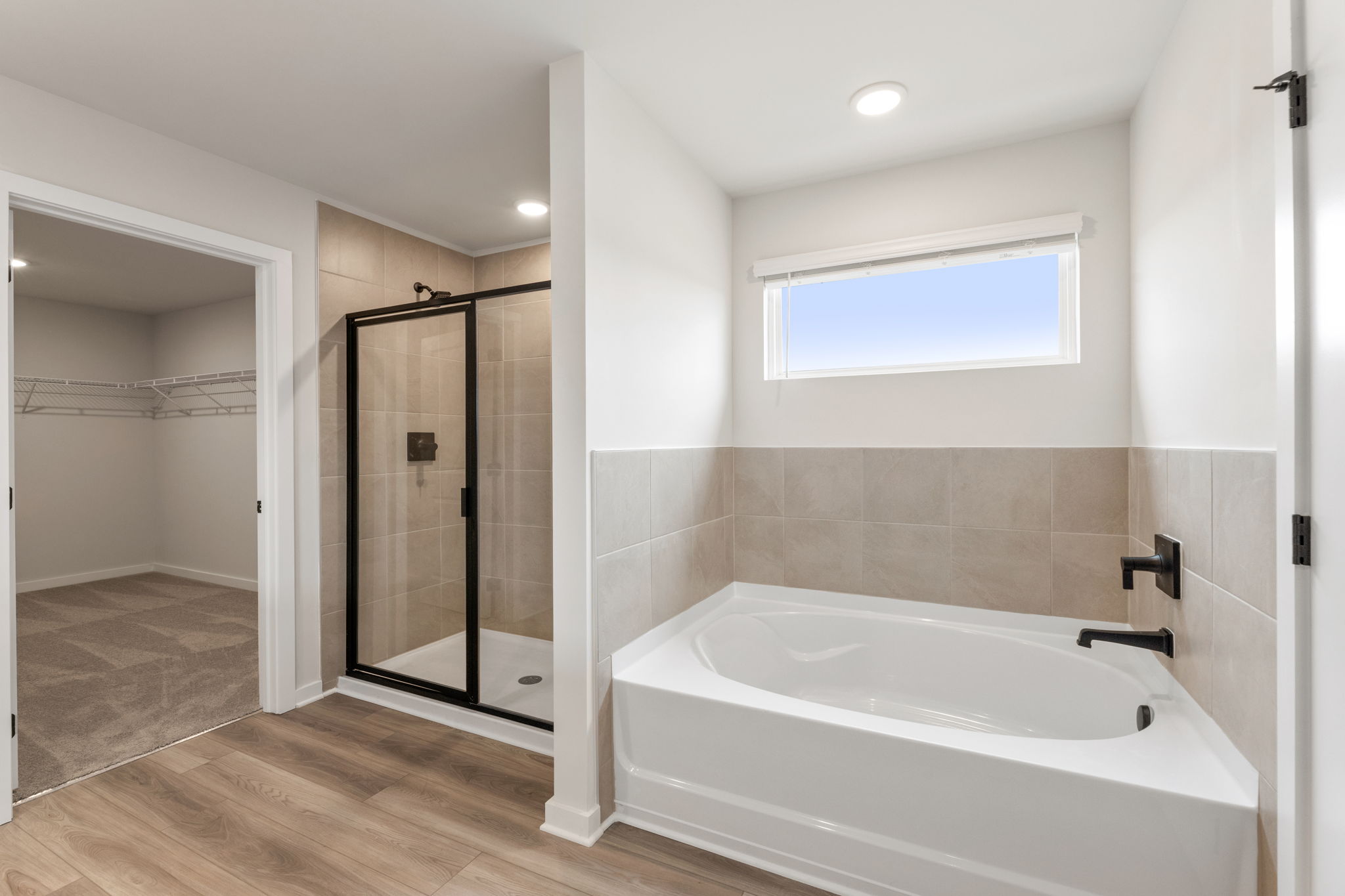 A bathroom with a tub and shower.