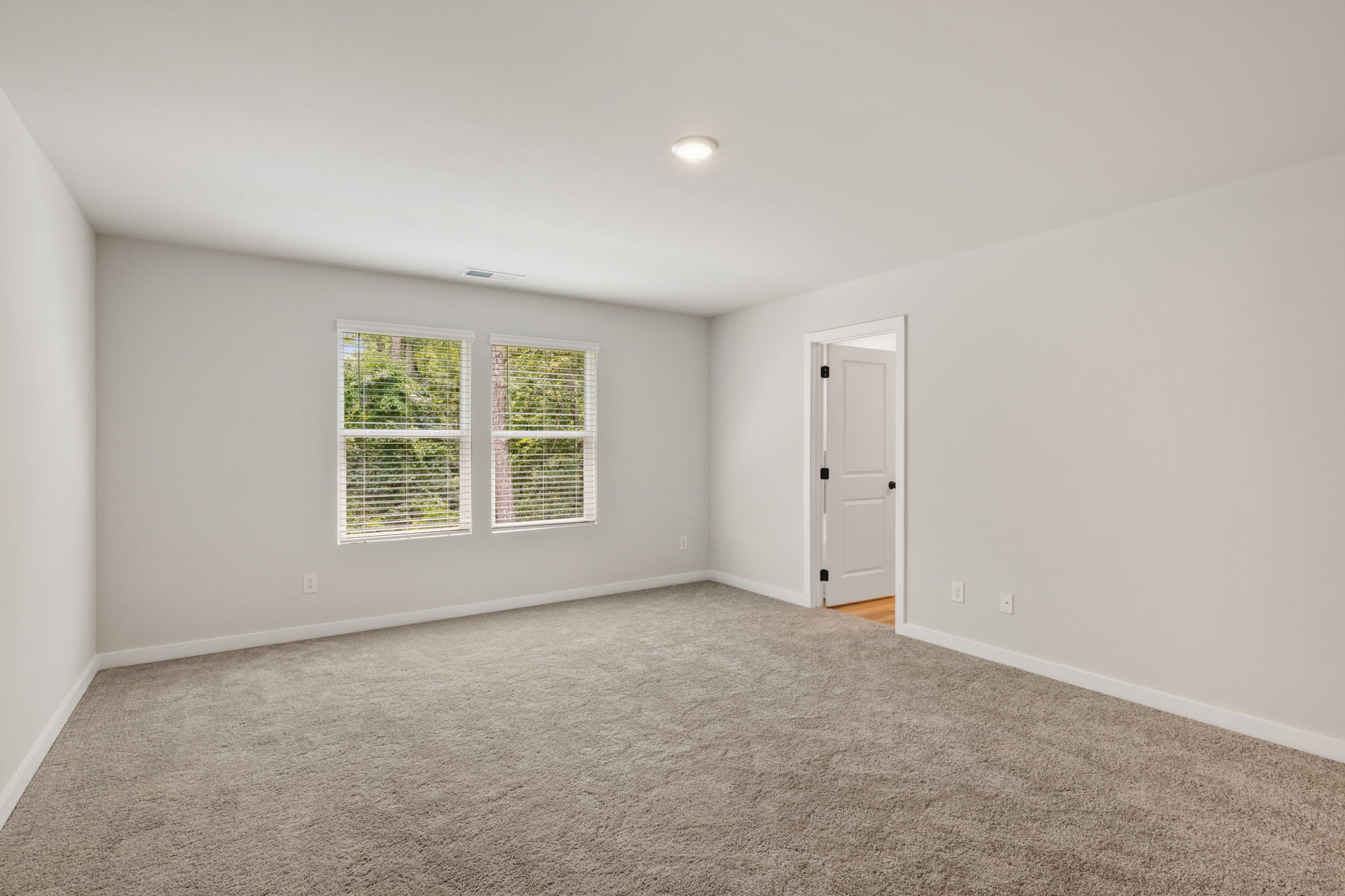A room with a door and a window.