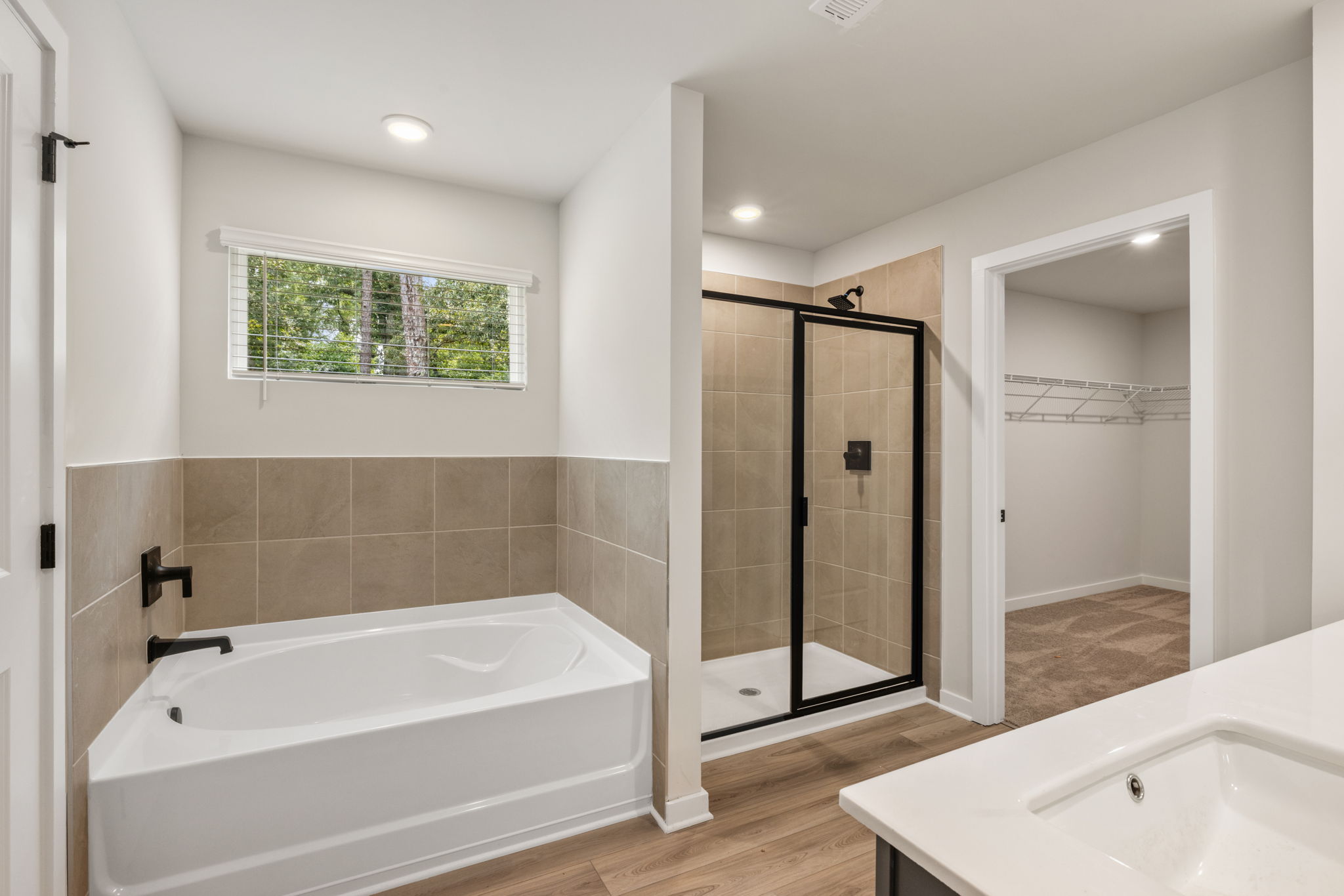A bathroom with a tub and shower.