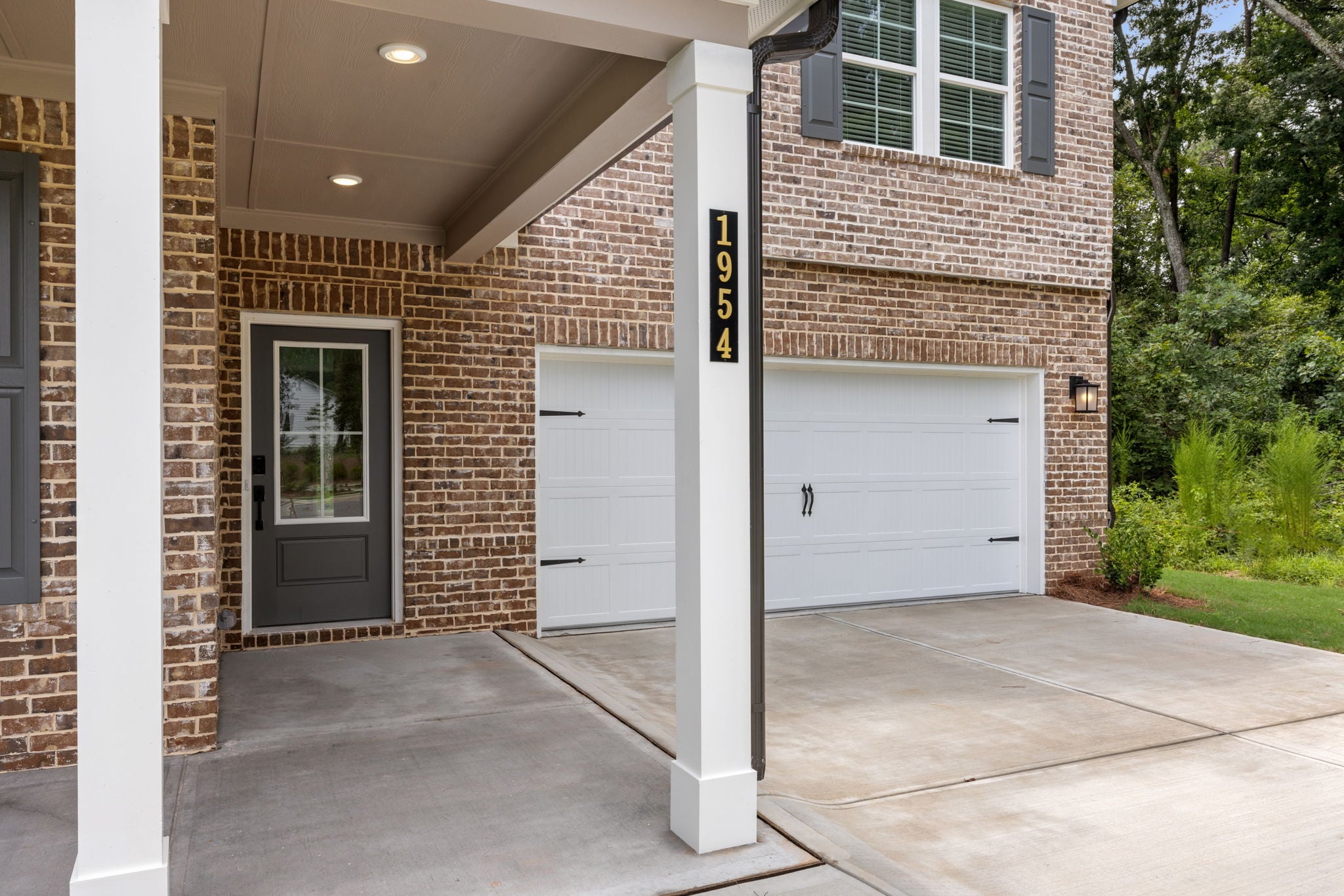A brick building with garage doors.