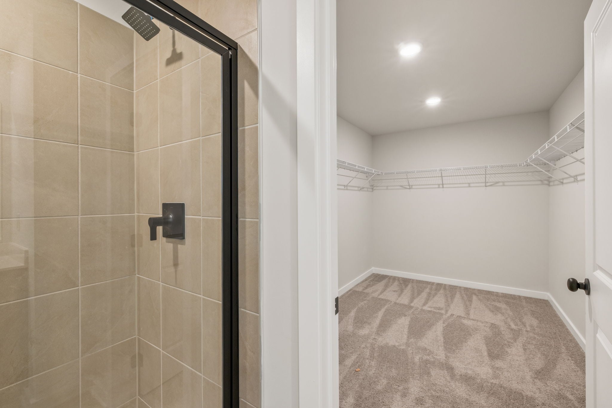 A shower with a glass door.