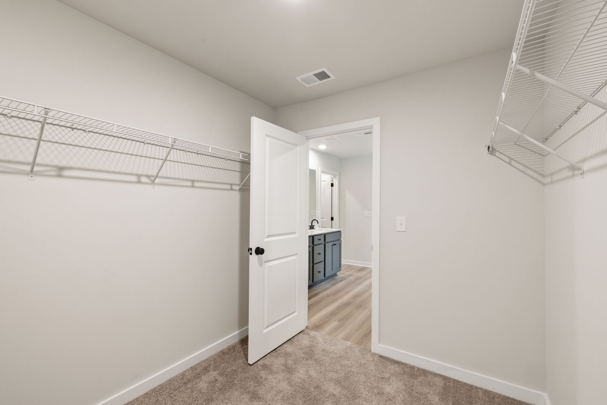 A hallway with white walls.