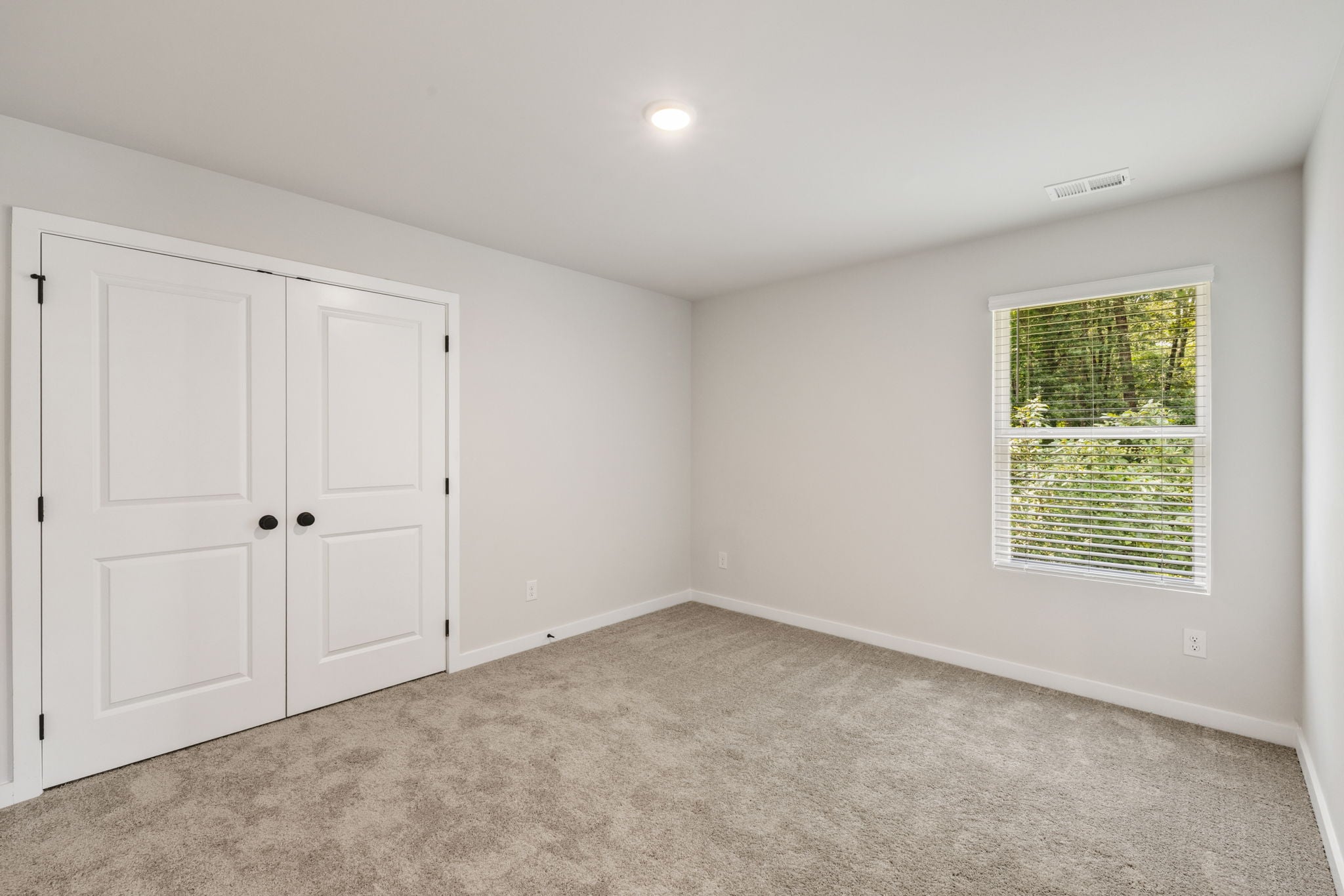 A room with white doors.