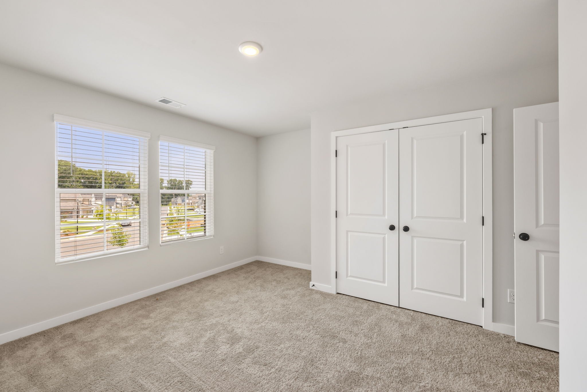 A room with white doors and windows.