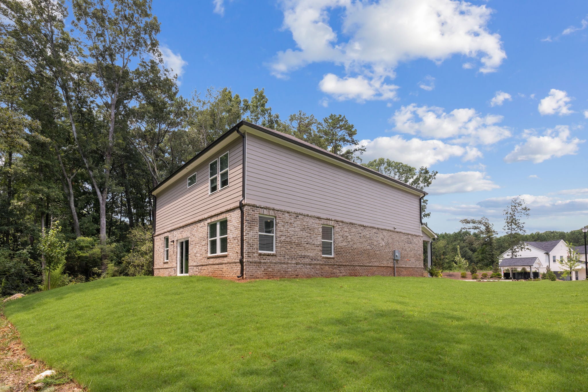 A house in a grassy field.