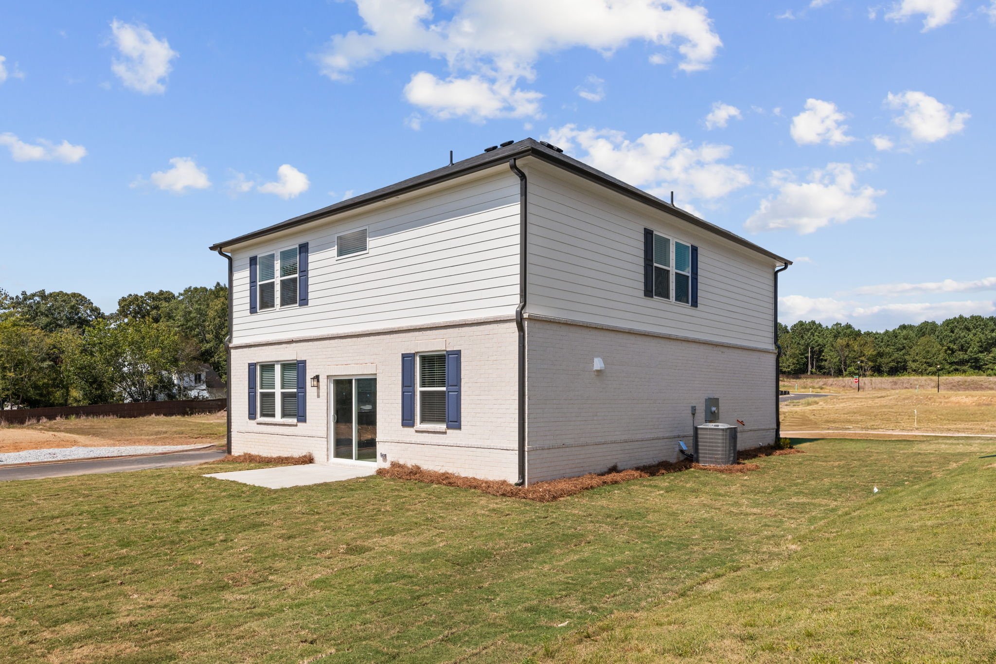 A house with a grass yard.