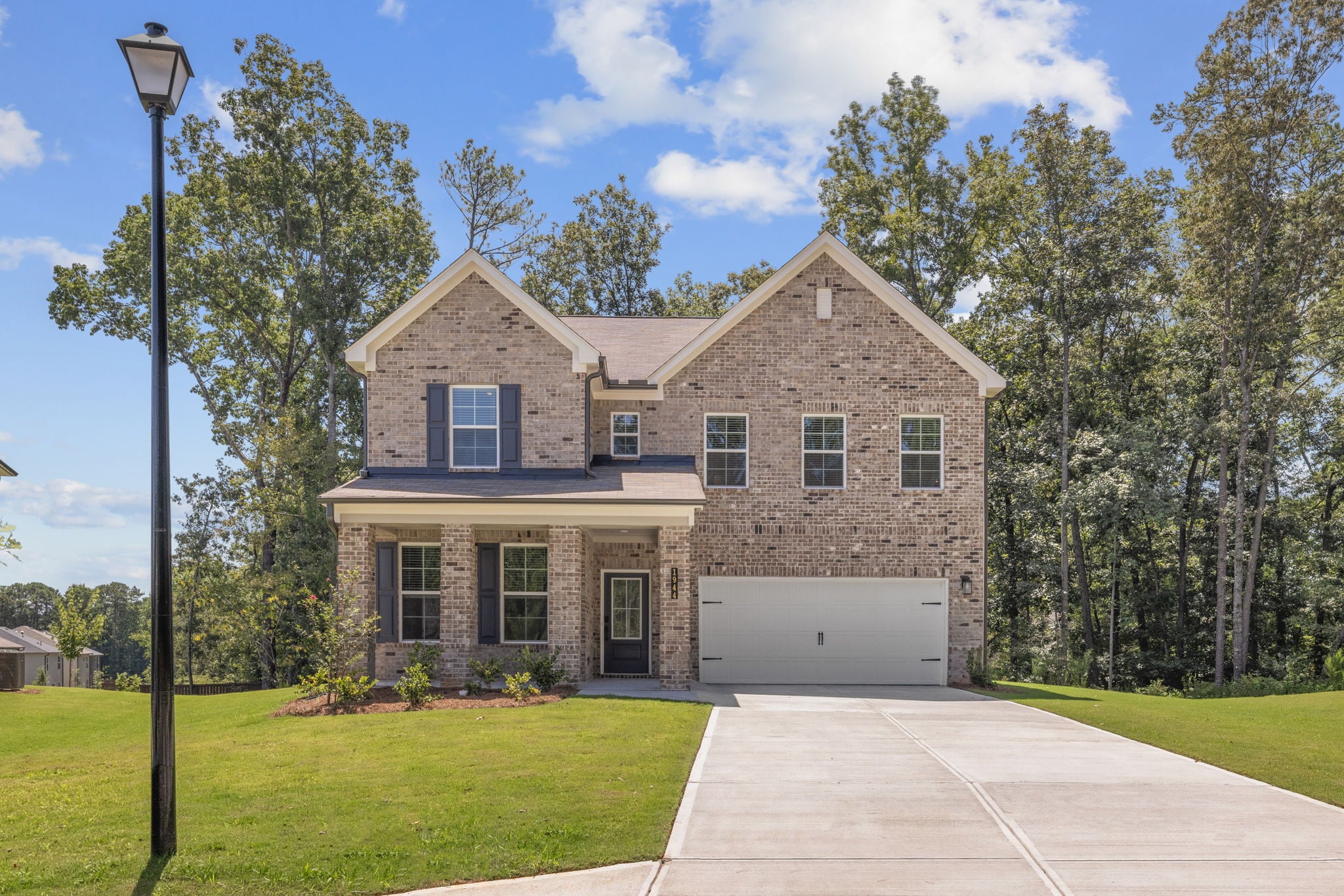 A brick building with a driveway.