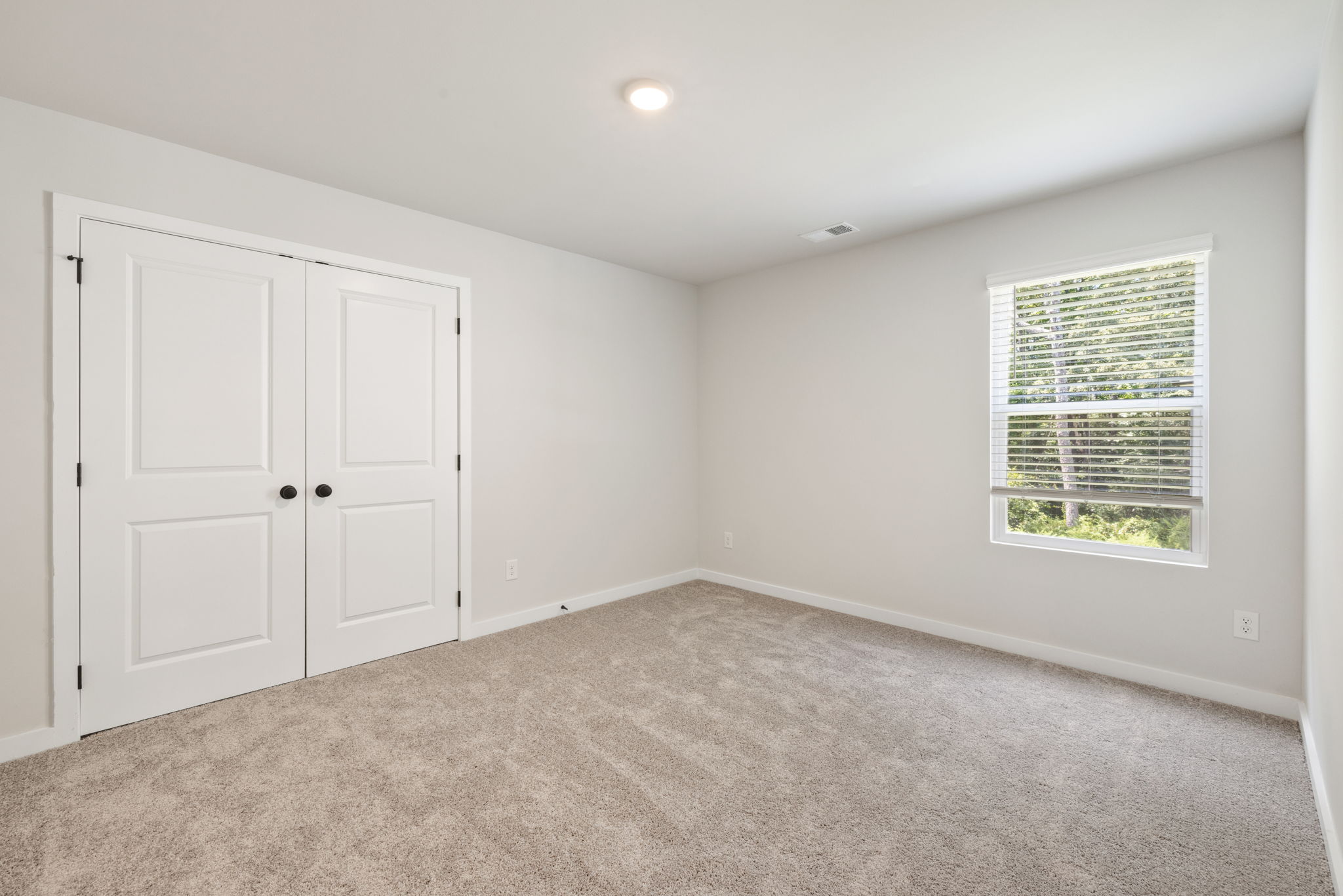 A room with white doors.